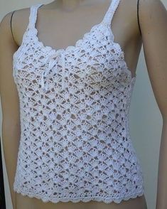 a mannequin wearing a white crochet top with an attached halter