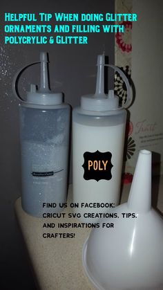 two plastic bottles with lids on top of a counter next to a crafter's hook