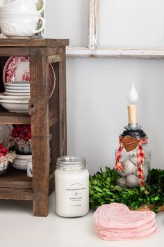 an assortment of dishes and candles on a table