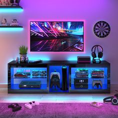 a television that is sitting on top of a entertainment center in a room with purple lighting