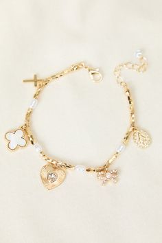 Elevate your everyday look with this versatile gold charm bracelet. Its adjustable design ensures a perfect fit, while the delicate gold chain adds uniqueness. Perfect for layering or wearing solo, this bracelet is a must-have for any jewelry collection. Gold-plated Bracelets With Dangling Charms, Adjustable Gold-plated Charm Bracelet, Adjustable Gold-plated Bracelet With Charms, Adjustable Gold Plated Bracelet With Charms, Adjustable Gold Rosary Bracelet With Charms, Gold Dainty Charm Bracelet With Extender, Dainty Metal Charm Bracelet With Extender, Adjustable Gold Charm Bracelet With Delicate Chain, Everyday Gold Bracelets With Dangling Charms