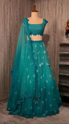 seasonsindia.com prouduct  PEACOCK BLUISH GREEN LEHENGA SET WITH ‘ABLA’ WORK PAIRED WITH A MATCHING SCALLOPED DUPATTA AND TIKLI WORK BLOUSE.  beach wedding Abla Work, Half Saree Lehenga, Wedding Lehenga Designs