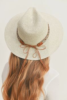 Add a touch of boho charm to your look with this stylish Straw Panama Fedora Hat! Quality crafted and accented with a Boho embroidered band, this hat is the perfect way to stay looking cool and on-trend. Plus, the suede tie accent gives it a unique touch! Material: 100% paper straw Circumference: 22" Brim length: 3.25"