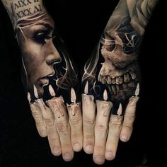 two hands that have tattoos on them, one with a skull and the other with a woman's face