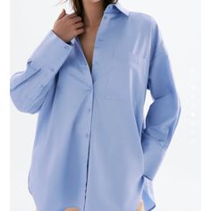 Oversized Fit Brand New With Tag Size Small Oversized Blue Shirt For The Office, Oversized Blue Shirt For Work, Oversized Light Blue Shirt With Pockets, Oversized Light Blue Collared Shirt, Oversized Light Blue Shirt For Work, Casual Oversized Light Blue Blouse, Oversized Blue Top For Office, Oversized Blue Button-up Shirt, Spring Blue Oversized Blouse