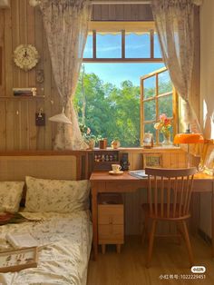 a bedroom with a bed, desk and chair in front of a window that looks out onto the woods