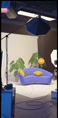 a blue couch sitting on top of a white floor next to an umbrella and some lights