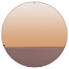 a round mirror with an orange and black stripe pattern on it's side, in front of a white background