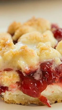 a close up of a plate of food with crumbs and jelly on it