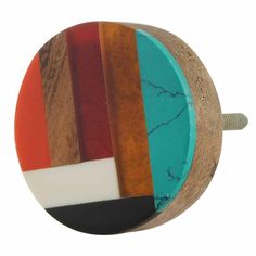 a round wooden knob with multicolored stripes on the front and back of it