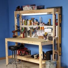 there is a shelf with many bottles on it and two stools next to it