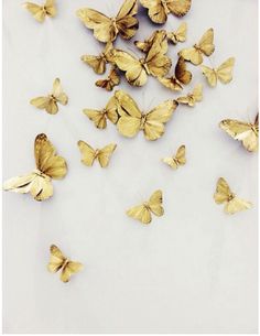 some yellow butterflies are on a white surface and there is the words sweet dreams above them