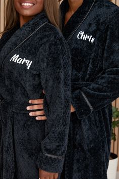 two women in robes standing next to each other