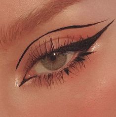 a woman's eye with long black lashes