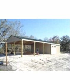 a garage with two carports in the middle of it