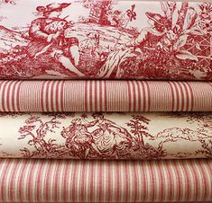 four red and white fabrics stacked on top of each other in different sizes, colors and patterns