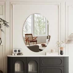 a living room with a large round mirror on the wall