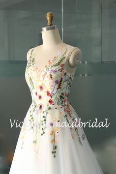 a white dress with colorful flowers on it