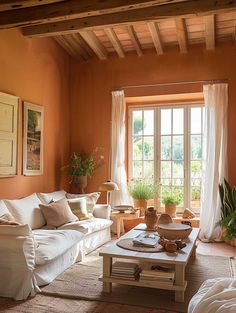 a living room filled with furniture and windows