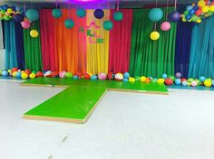 a brightly colored stage set up for a birthday party