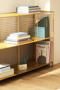 a book shelf with books and magazines on it