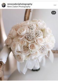 a bridal bouquet sitting on top of a chair