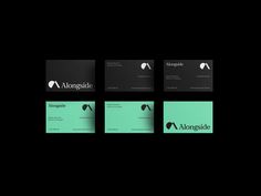 four different business cards on black and green