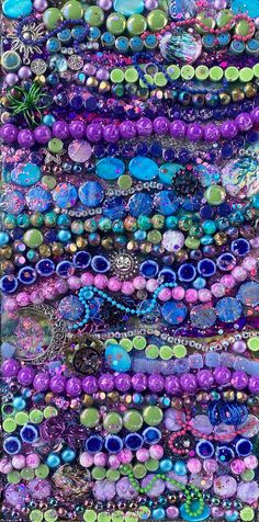 an art work with many different colors and shapes on it's sides, including beads