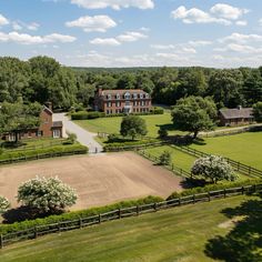 an aerial view of a large farm house