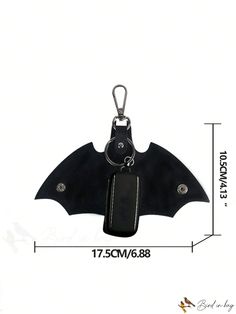 a bat shaped keychain with a black leather case and silver hardwares is shown