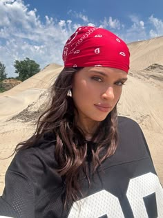 desert, festival, outfit, football jersey, graphic t-shirt, red bandana, western, sunglasses, sand, sneakers, Ardene, #ardenelove Festival Inspo Pics, Outfits With Bandanas, Red Bandana Outfit, Western Sunglasses, Bandana Streetwear, Outfit Bandana, Bandana Fits, Baggy Tshirt