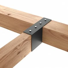 a close up of a wooden bench with metal brackets on the top and bottom part