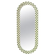 a green and white checkered oval mirror