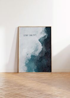 a poster with the words stay safety on it in front of a white wall and wooden floor