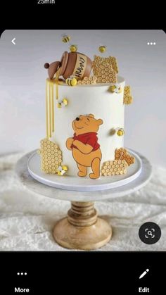 a winnie the pooh cake with honey decorations