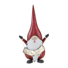 a red and white gnome figurine holding a merry christmas banner