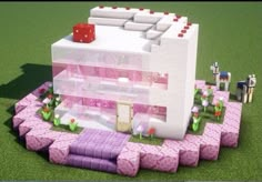 a pink and white house made out of blocks