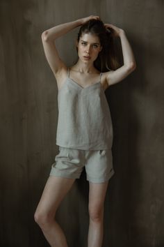 Skin friendly 100% linen top is for timeless wearing. This model features adjustable straps. Lightweight linen tank top can be paired with denim, shorts or even skirts so it's easy to wear in your daily life during tropical summer weather or as a layer with blazer during chilly evenings.  Camisole design delivers minimalist design for your daily outfit.  Adjustable spaghetti strap top is so easy to wear.  Basic top LINDA is handmade of 100% pure linen.  Model is 5.9ft (180cm) tall, wearing size Summer Loungewear Camisole, Summer Loungewear Tank Top With Adjustable Straps, Summer Tank Top With Adjustable Straps For Loungewear, Spring Sleeveless Linen Camisole, Beige Linen Tank Top For Beach, Chic Linen Tank Top With Adjustable Straps, Simple Beige Tops For Summer, Simple Beige Summer Tops, Summer Linen Camisole Tank Top