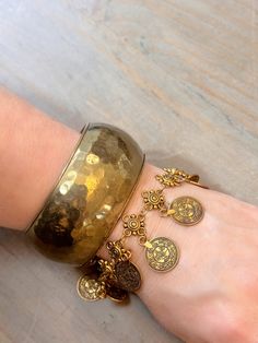 Set of two Vintage bracelets: a wide chunky brass bangle bracelet in hammered finish and an antique gold coin bracelet. These are both "One of a kind" and vintage! Once they are sold - they will not be offered again. Measurement: Bungle - 2.5" inner diameter. Coin bracelet - 7" with 1.5" extension chain. Brass Bangle, Coin Bracelet, Gold Coins, Vintage Bracelets, Bracelet Stack, Chain Link Bracelet, Chain Link, Antique Gold, Antique Brass