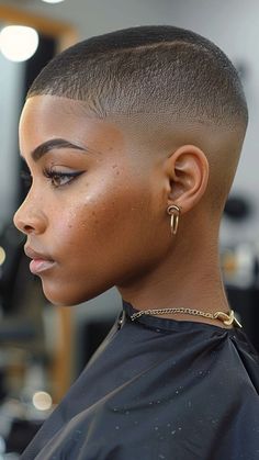 Embrace a bold, minimalist look with a Buzz Cut from our 30 Short 4C Hairstyles guide! This low-maintenance style highlights your natural texture with effortless cool. Click the pin and follow us for more chic and easy hair ideas! #BuzzCut #4CHairstyles #NaturalHair #EffortlessChic #BoldStyles Fade On Women, Low Fade Women, Stud Haircut Black, Fade Black Woman, Black Woman Buzzcut, Afro Pixie Haircut, Short Natural Haircuts For African Women, Black Women Shaved Head, Black Women Buzzcut