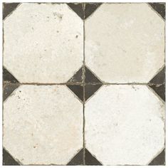 a black and white checkered tile floor with no grouting on the edges