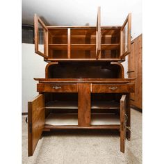 an old wooden desk with drawers and cupboards