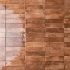 a tile wall with brown and tan colors