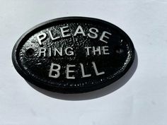 a black and white sign that says please bring the bell on it's side