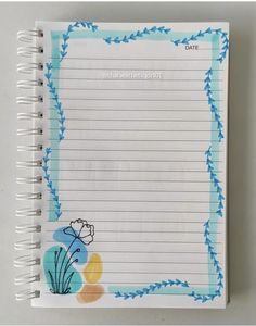 a notepad with flowers and vines on it