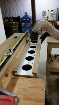 a workbench with some tools on it and a blow dryer in the middle