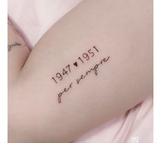 a woman's arm with writing on it that reads, 1917 - 2011 year sample