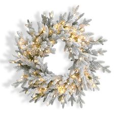 a christmas wreath with white lights and snow flakes on the front, against a white background