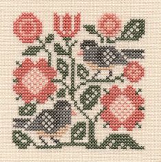 a cross stitch pattern with birds and flowers