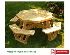 an octagon picnic table plans is shown in the grass with flowers behind it